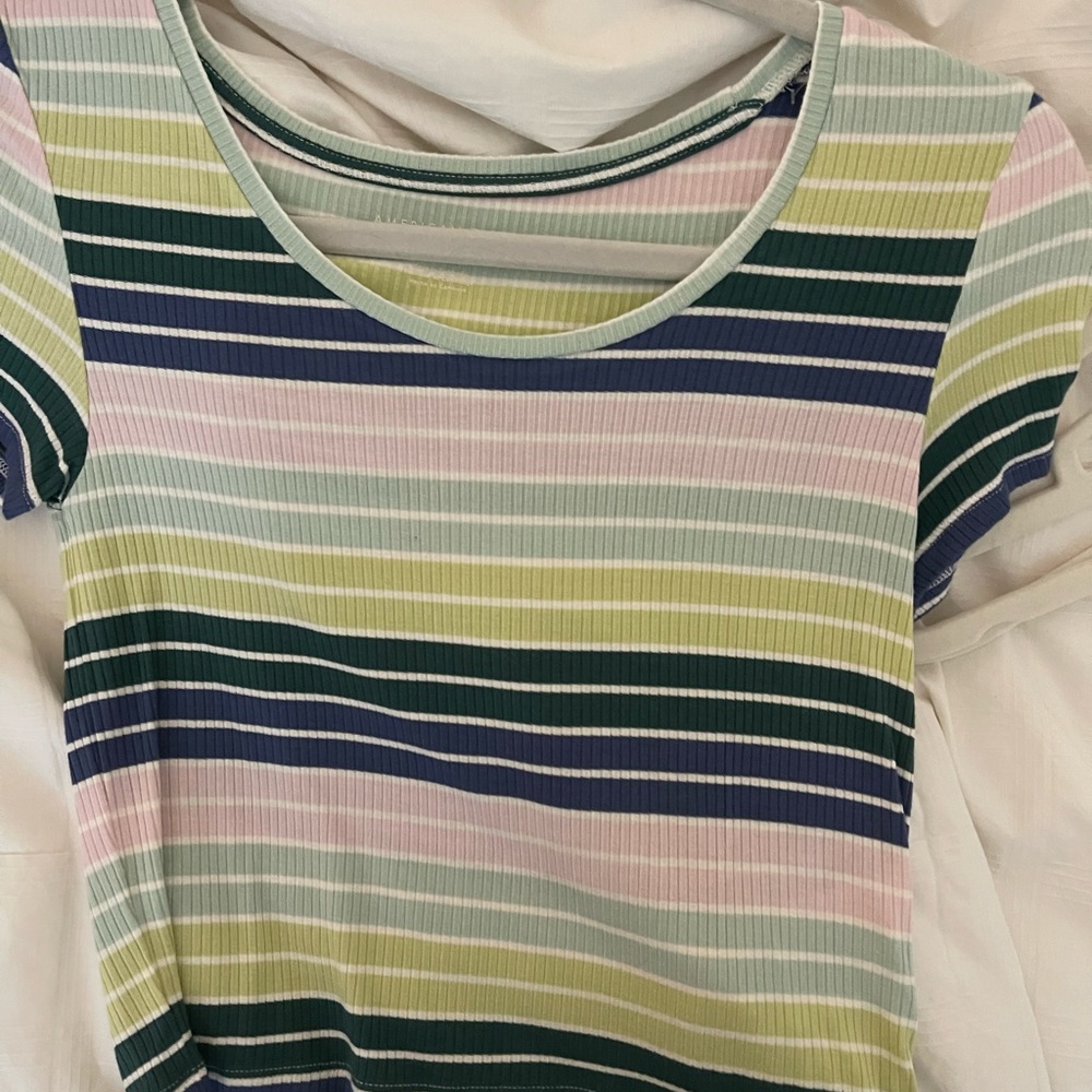 American Eagle green, purple, and blue size XS, and fits tight.